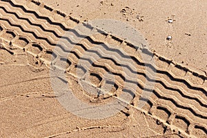 Tire track on the beach. Tire footprint in the sand