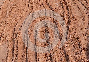 Tire track of many vehicle on soil mud road in countryside in rainy season