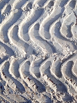 Tire track in snow, tread, dirty snow