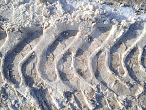 Tire track in snow, tread, dirty snow