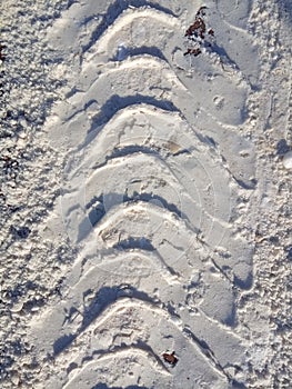 Tire track in snow, tread, dirty snow