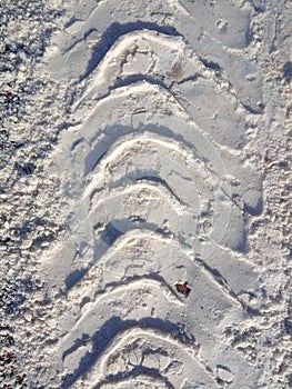 Tire track in snow, tread, dirty snow