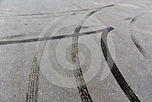 Tire tracks on asphalt.