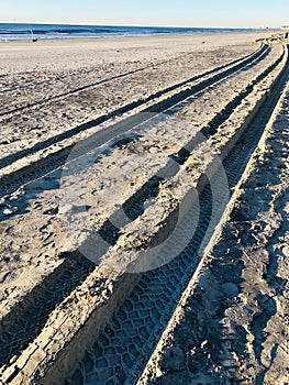 Tire tracks on the sand beach