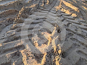 Tire tracks on sand photo
