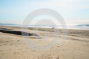 Tire tracks on sandy beach. Oceano Dunes Vehicular Recreational Aria, California photo