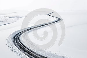 Tire tracks on a snow-covered road. Winter landscape.
