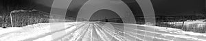 Tire tracks in snow. Slippery road over bridge