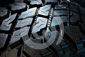 Tire treads texture, dark abstract background