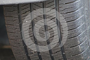 Tire treads on a vehicle with dirt and rocks