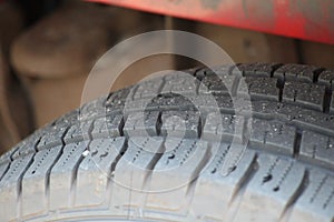 Tire treads on a vehicle with dirt and rocks