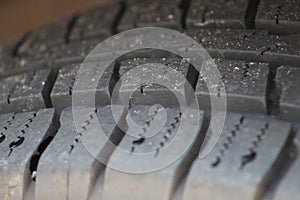 Tire treads on a vehicle with dirt and rocks