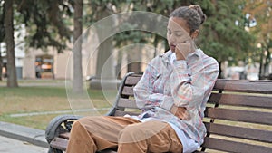 Tired African Woman Sleeping while Sitting Outdoor on Bench