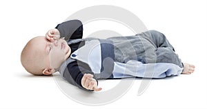 Tired baby on floor isolated on white
