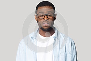 Tired black male in glasses feel sleepy or exhausted