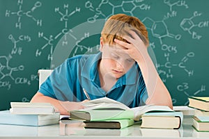 Tired Boy Studying In Classroom