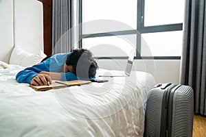 Tired business traveler sleeping at hotel room