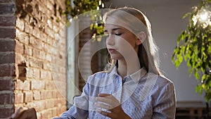 Tired business woman in glasses working with tablet at office. Portrait young Caucasian female student using wireless