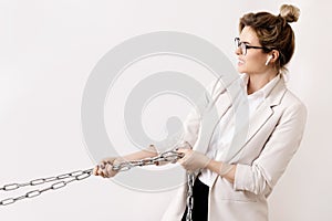 Tired business woman is pulling the chains