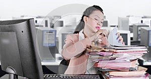 Tired business woman sleeping above documents