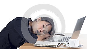 Tired business woman sleeping at her desk