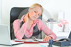 Tired business woman working with documents