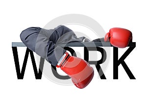 Tired businessman with boxing glove after fight with hard work