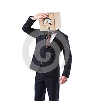 tired businessman with cardboard box on head