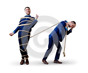 Tired businessman pulls tied himself with a rope.