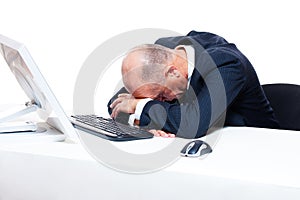 Tired businessman sleeping on his workplace