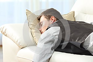 Tired businessman sleeping after work
