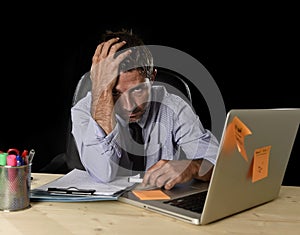 Tired businessman suffering work stress wasted worried busy in office late at night with laptop computer