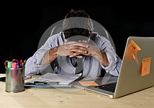 Tired businessman suffering work stress wasted worried busy in office late at night with laptop computer