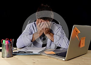 Tired businessman suffering work stress wasted worried busy in office late at night with laptop computer