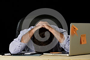 Tired businessman suffering work stress wasted worried busy in office late at night with laptop computer