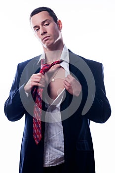 Tired businessman taking of his clothes