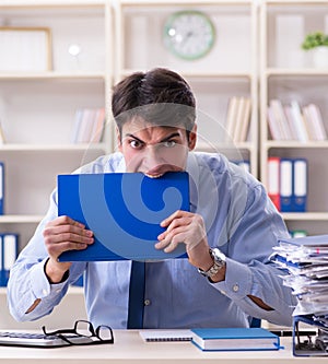 Tired businessman with too much paperwork