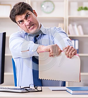 Tired businessman with too much paperwork