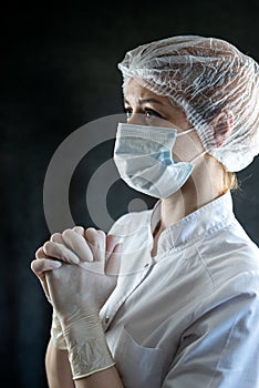 tired caucasian female doctor are praying at the hospital