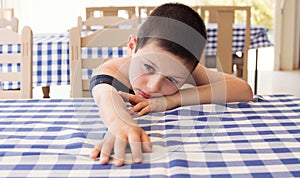 Tired child in restaurant
