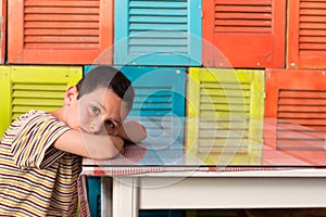 Tired child resting on table