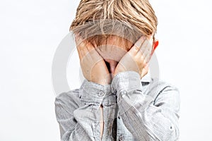Tired child scratching eyes, crying, bored, shy or playing peekaboo photo