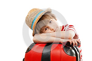 The tired child with suitcase