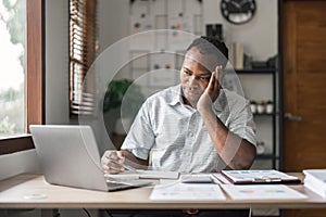 Tired depressed bored Africans businessman frustrated by business failure