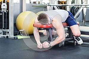 Tired and desperate men at the gym