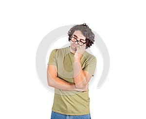 Tired and disinterested student falls asleep during class. Young man napping with hand under cheek. Long curly hair style casual