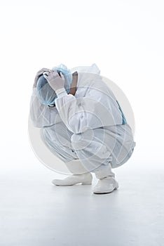 Tired doctor with protective clothing because of coronavirus