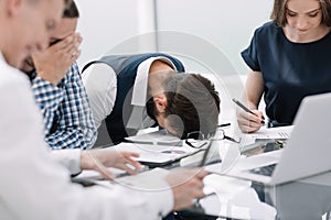 Tired employee at a business meeting in the office