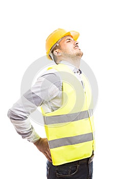 Tired engineer or builder suffering lower back lumbar pain