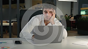 Tired exhausted Caucasian businessman bored fatigued male designer with computer project sad overworked overtime working